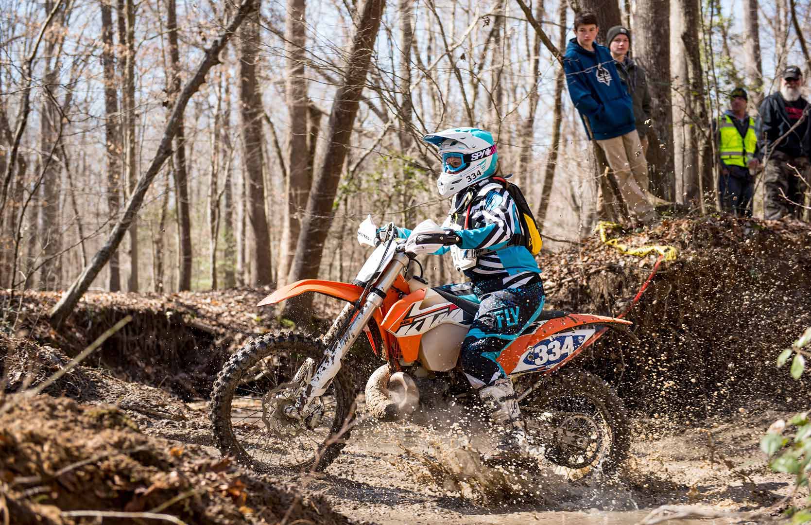 Amanda Knapp rides bike through creek