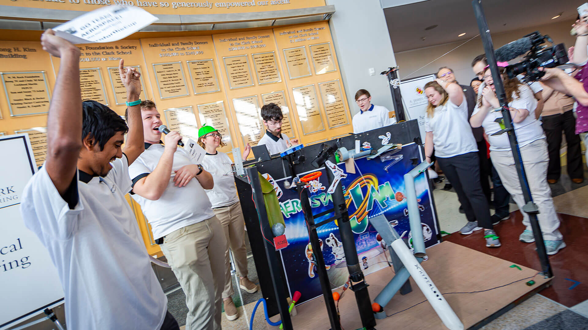 Students cheer while watching their machine at the Alumni Cup