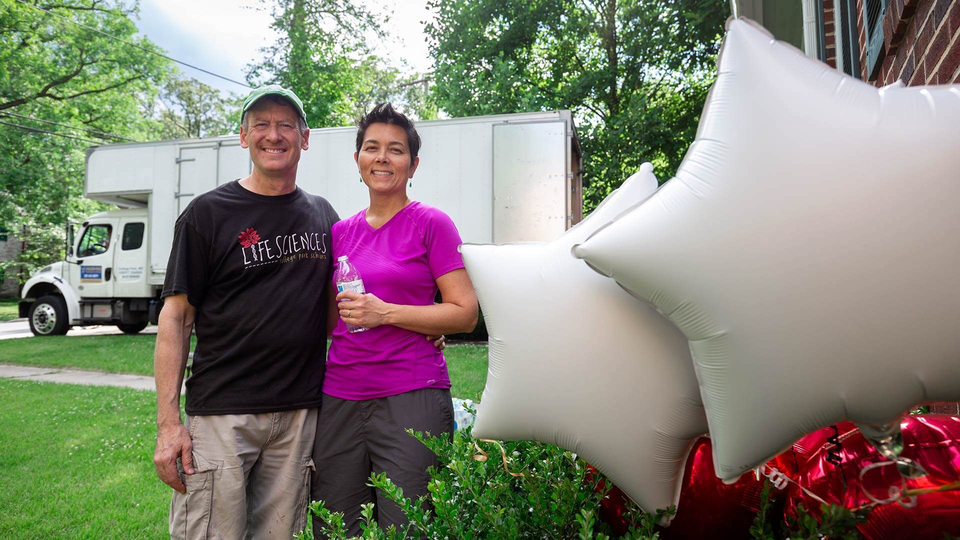Gene Ferrick and Joann Prosser pose in front of their new home in College Park