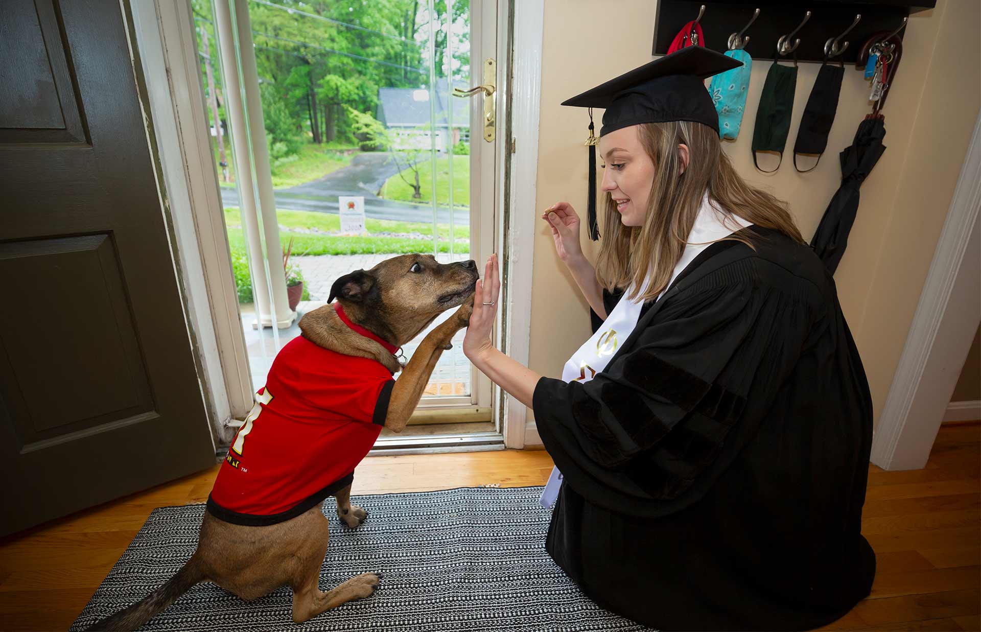 Lindsey Collins and dog high-five