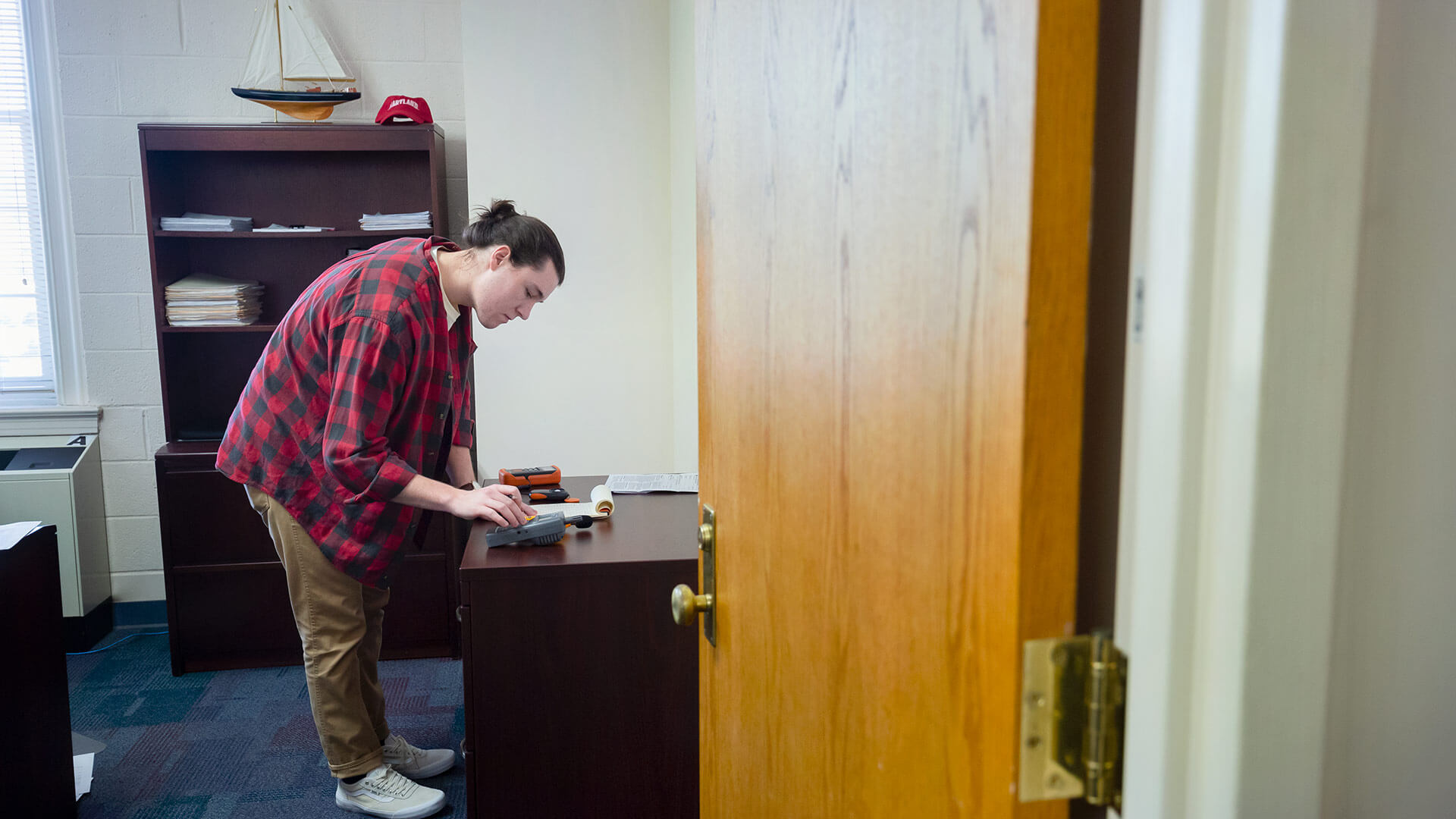 David Milner tests air humidity, air temperature, and natural light exposure in the Lee Building