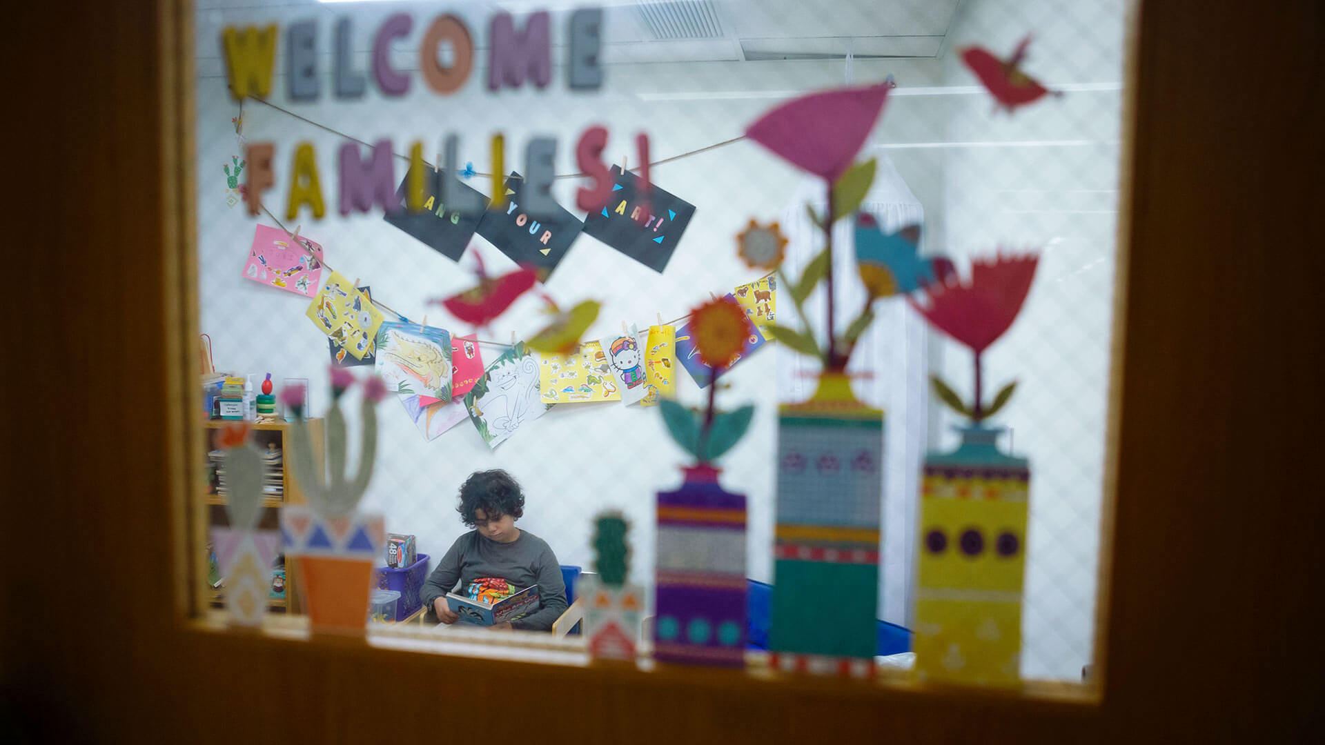Boy reads in Family Study Room