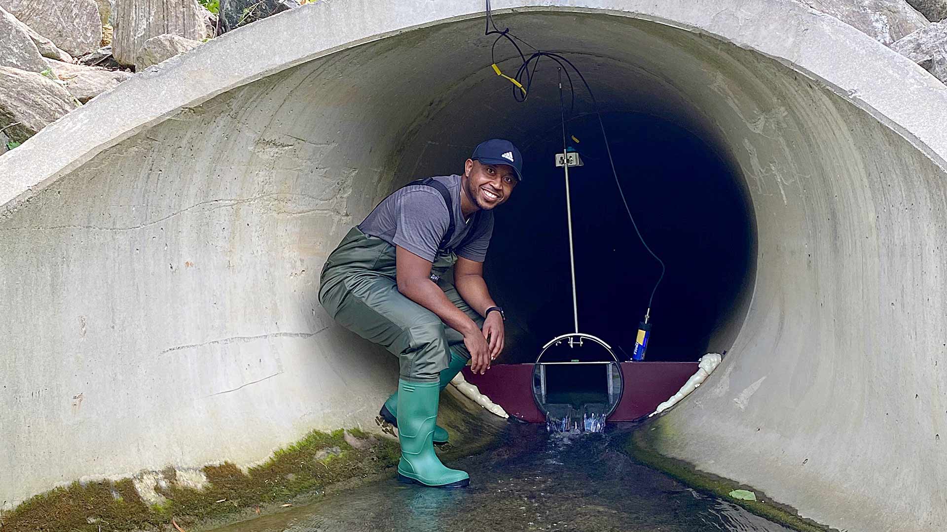 Marccus Hendricks installing stormwater sensor