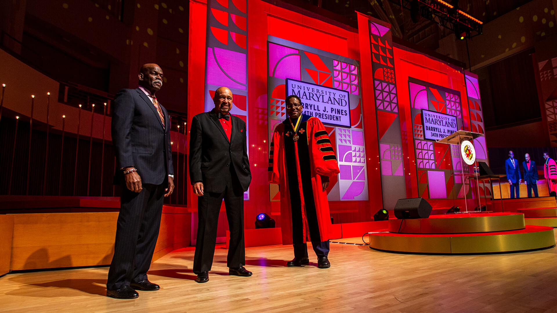 Billy Jones, Darryl Hill and Darryll J. Pines on stage during inauguration ceremony