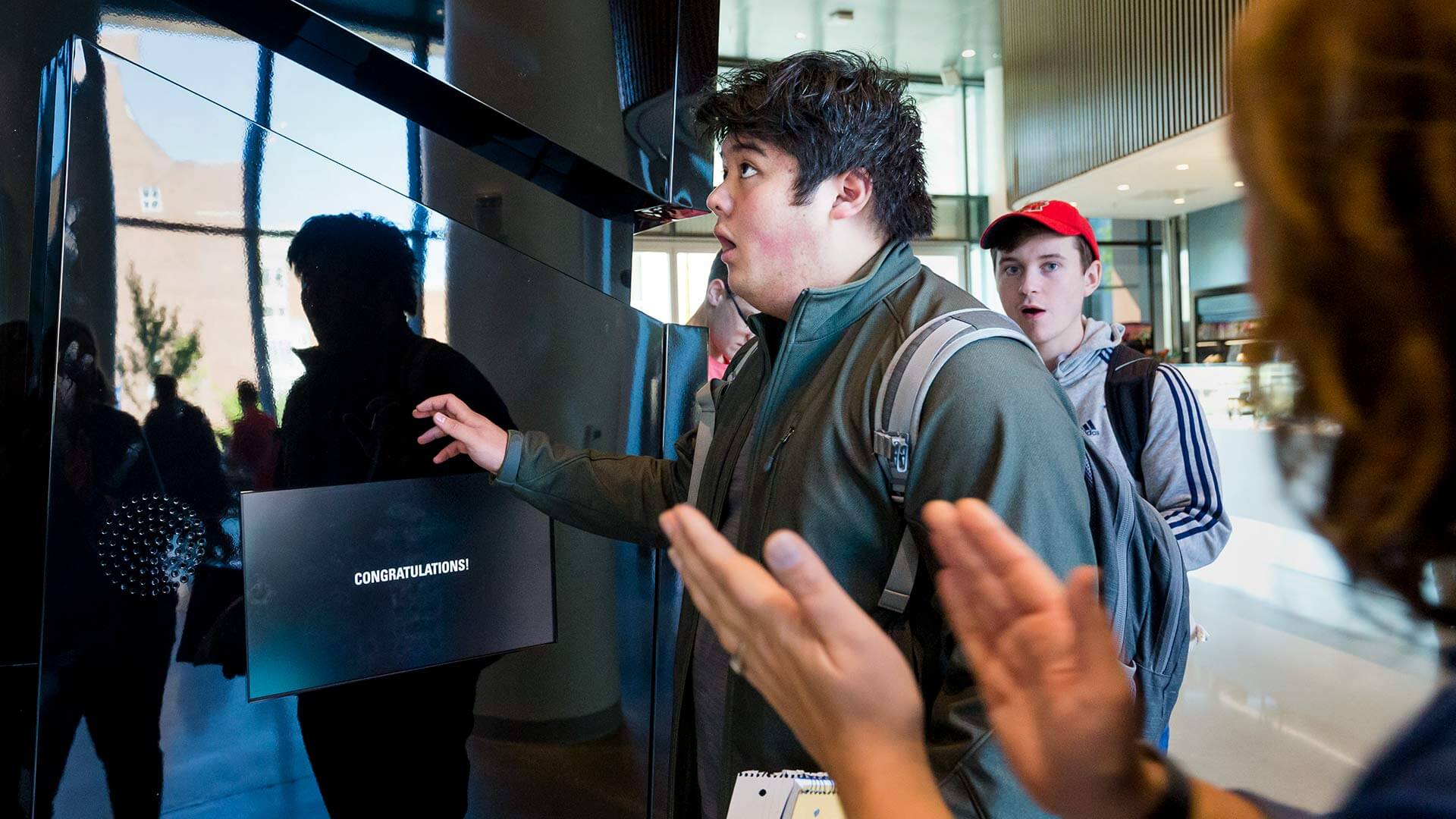 Two students enter the Lockheed Martin Challenge Box