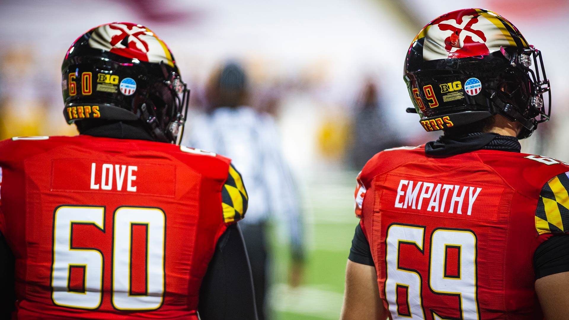 UMD football jerseys that say "Love" and "Empathy"