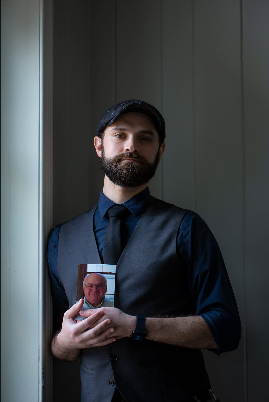 Max Escher holds a photo of his father