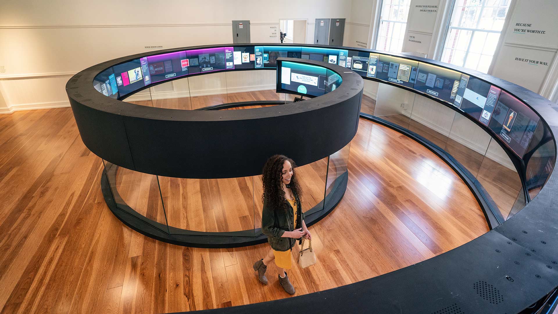 Woman views exhibit at Planet Word