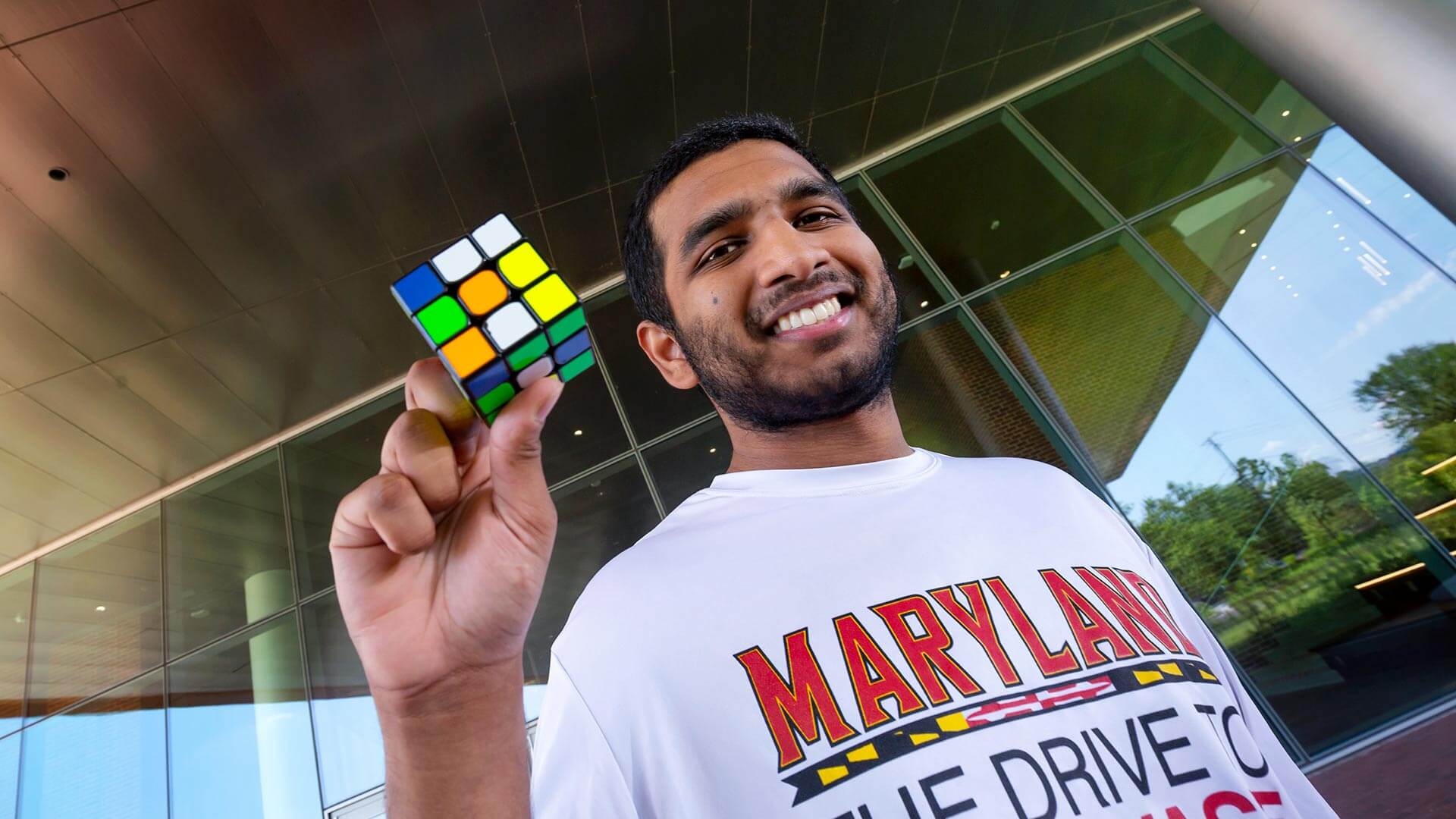 Pavan Ravindra with a Rubik's cube