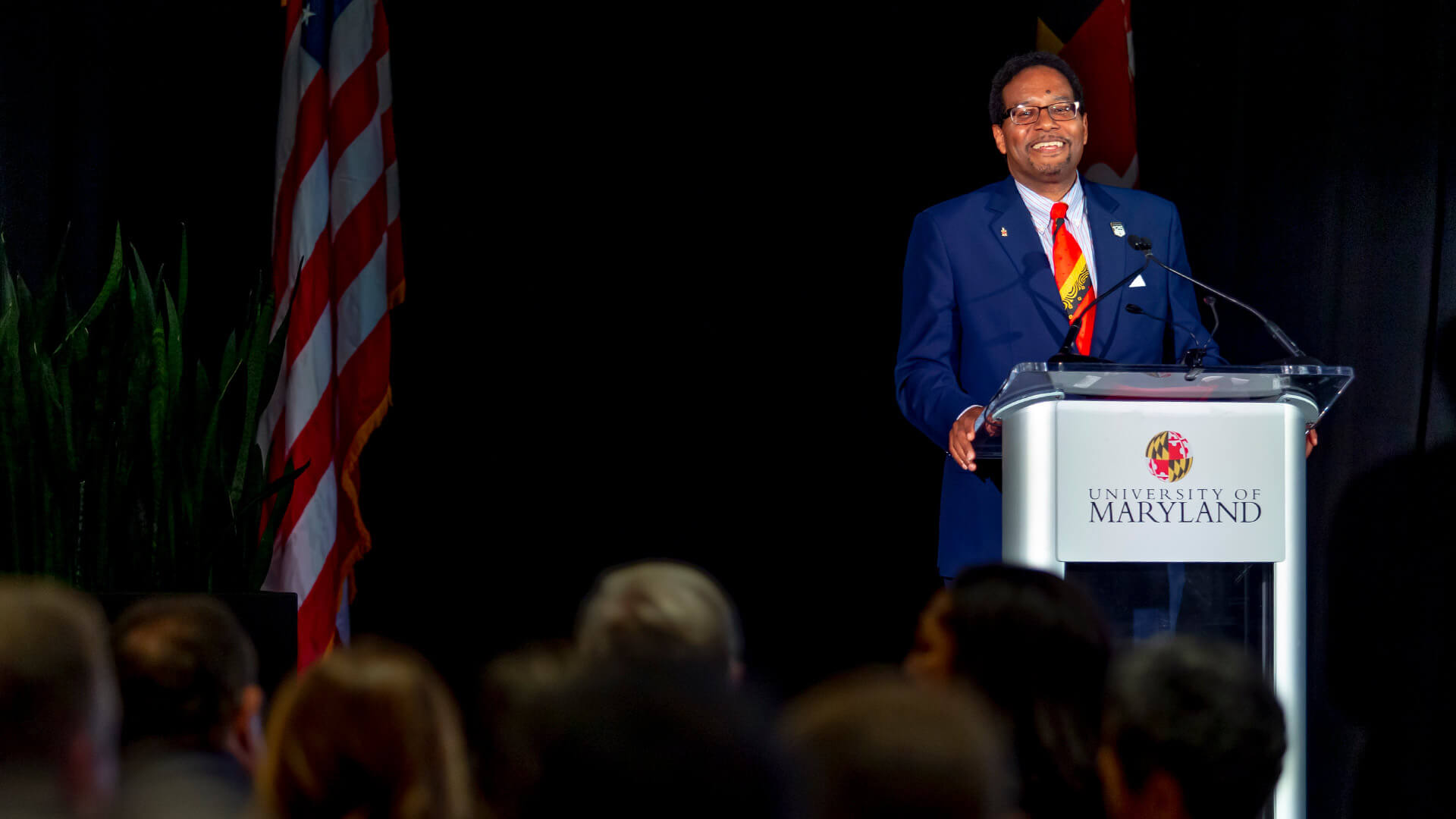 Darryll J. Pines speaks at the podium at a news conference