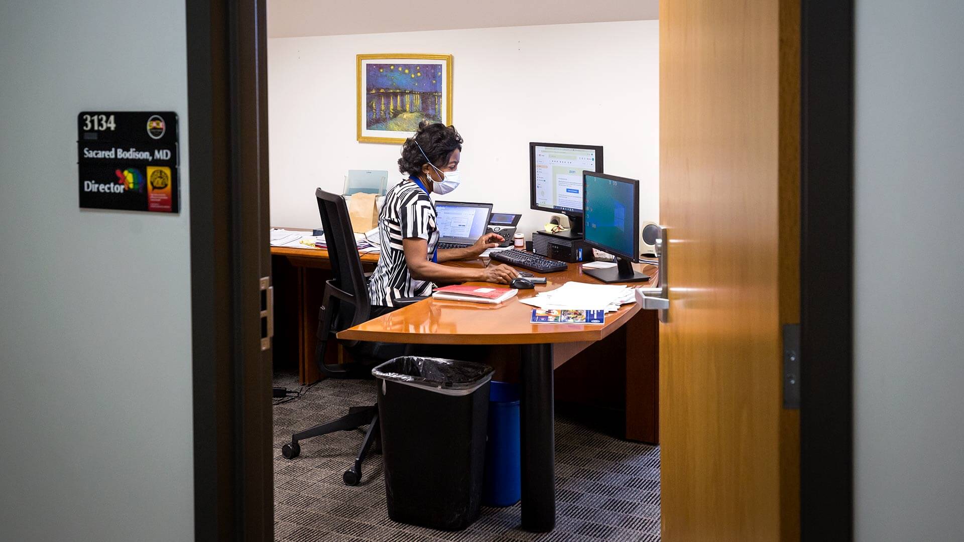 Dr. Bodison at her desk