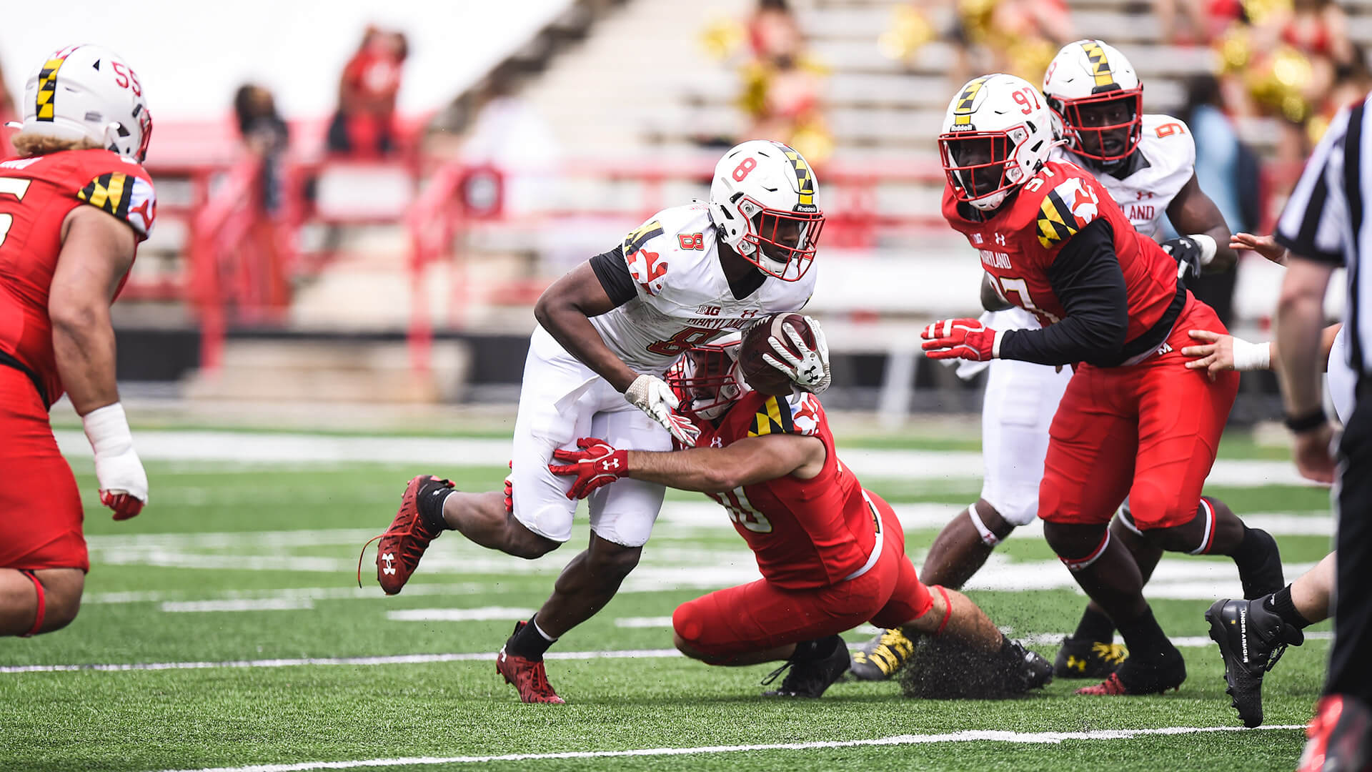 Tayon Fleet-Davis tries to break tackle in Spring Game