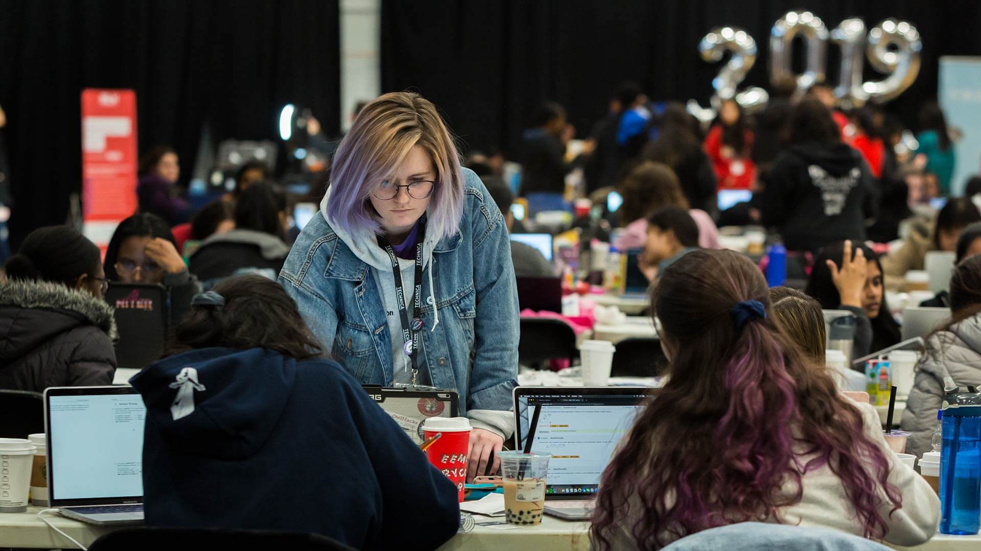 Annalise McLarnon, standing, a junior at Temple University, attended Technica for the second time this weekend.