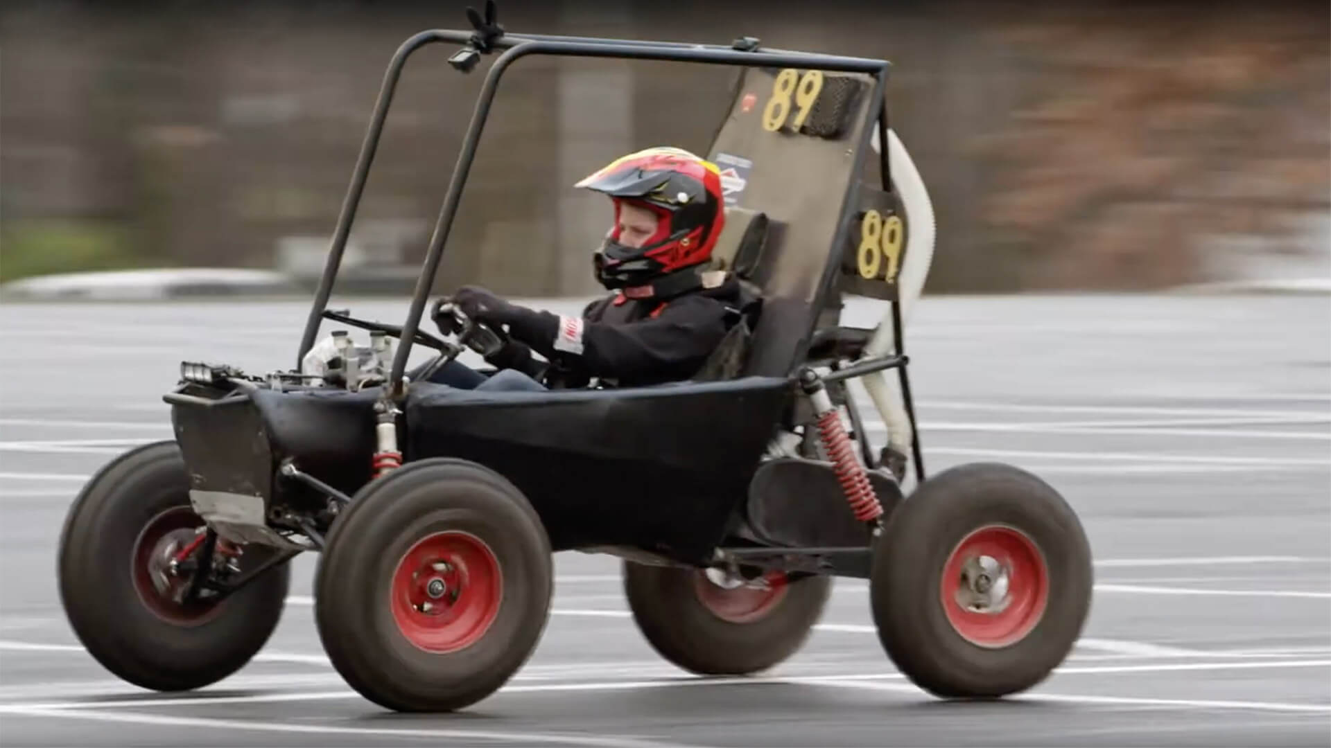 Member of Terps Racing driving a race car