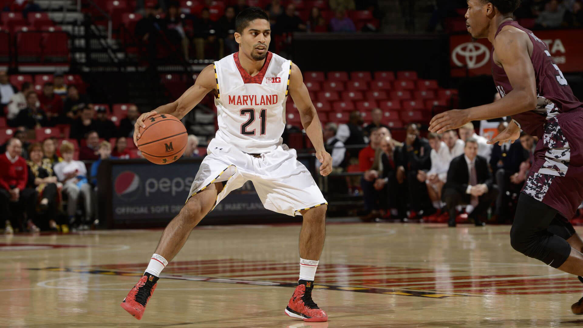 Varun Ram dribbling basketball